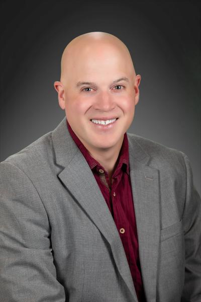 Portrait of Jad Greer, Chief Information Officer at OEO