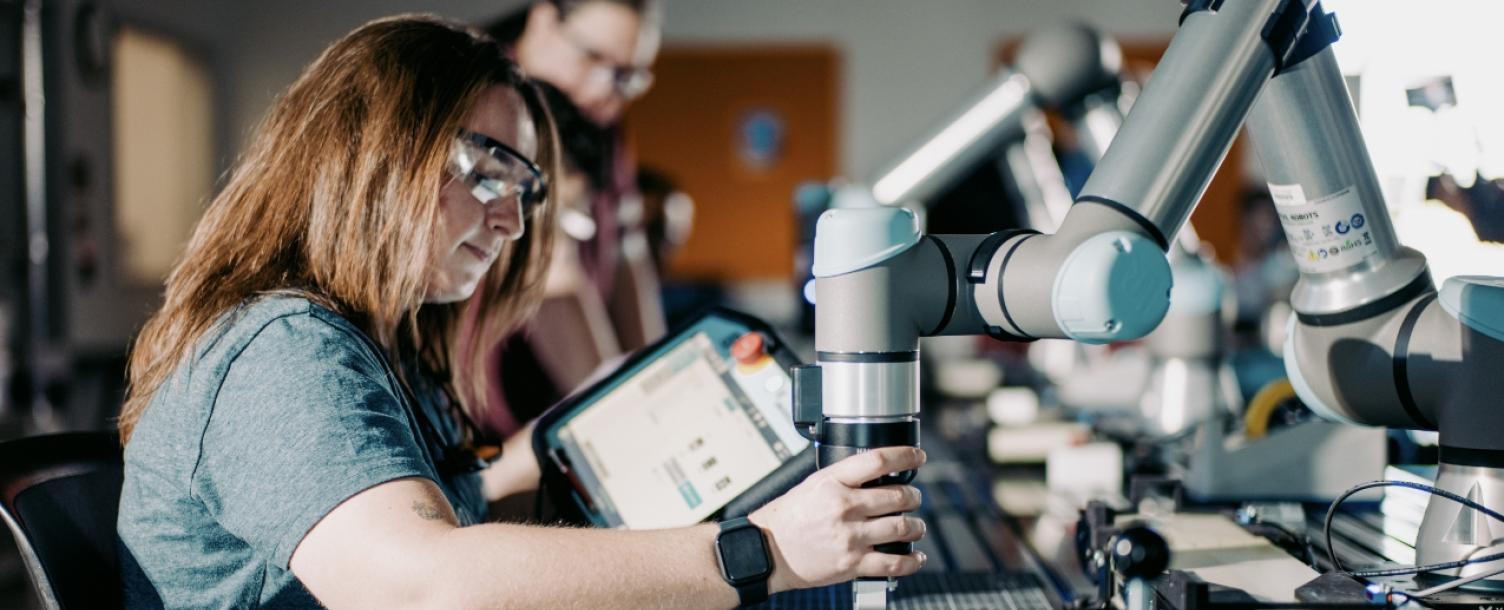 Person working with robotics in lab